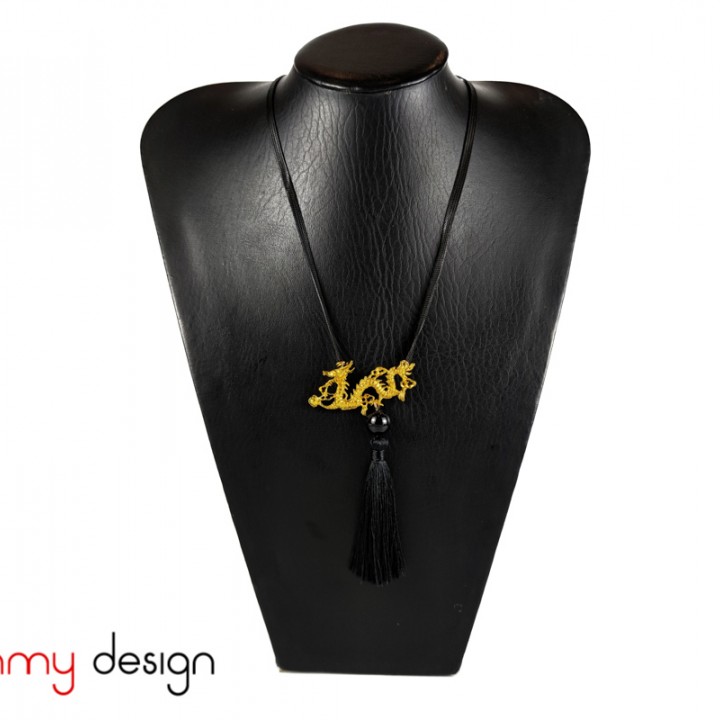 Necklace designed with yellow metal dragon, black tassel